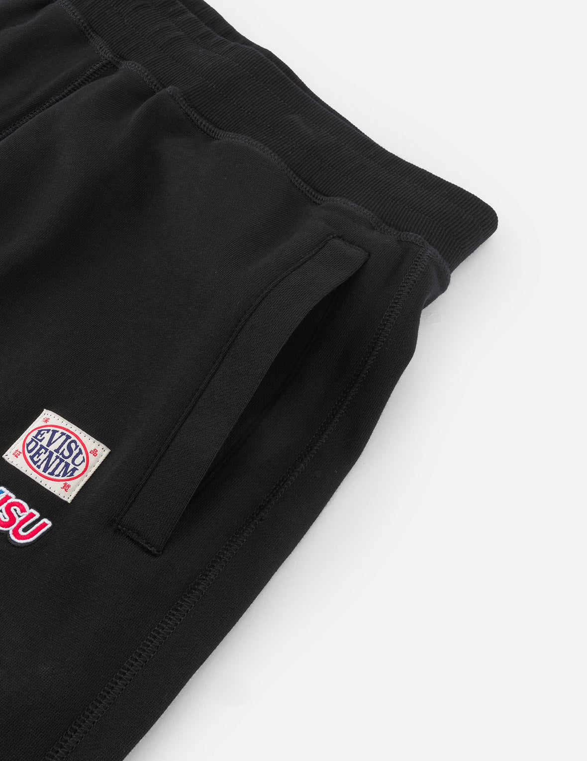 標語大M印花貼布繡口袋寬版運動褲