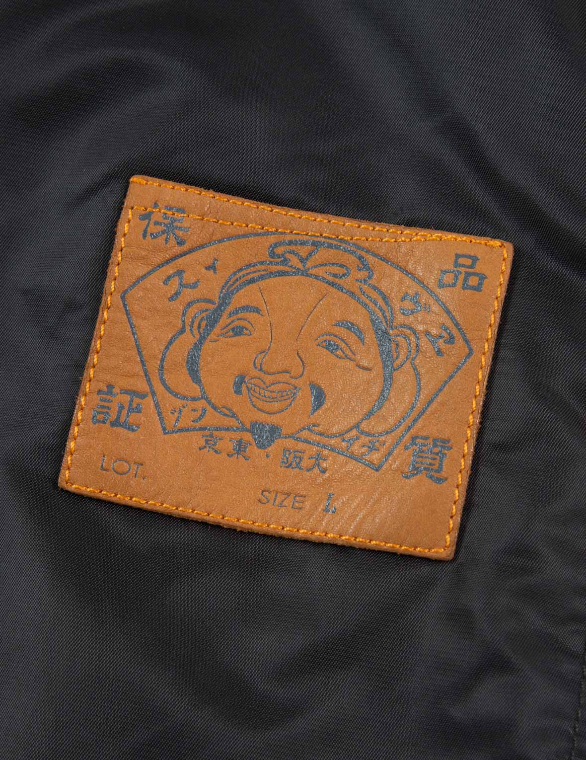 佛頭徽章與格言刺繡夾克