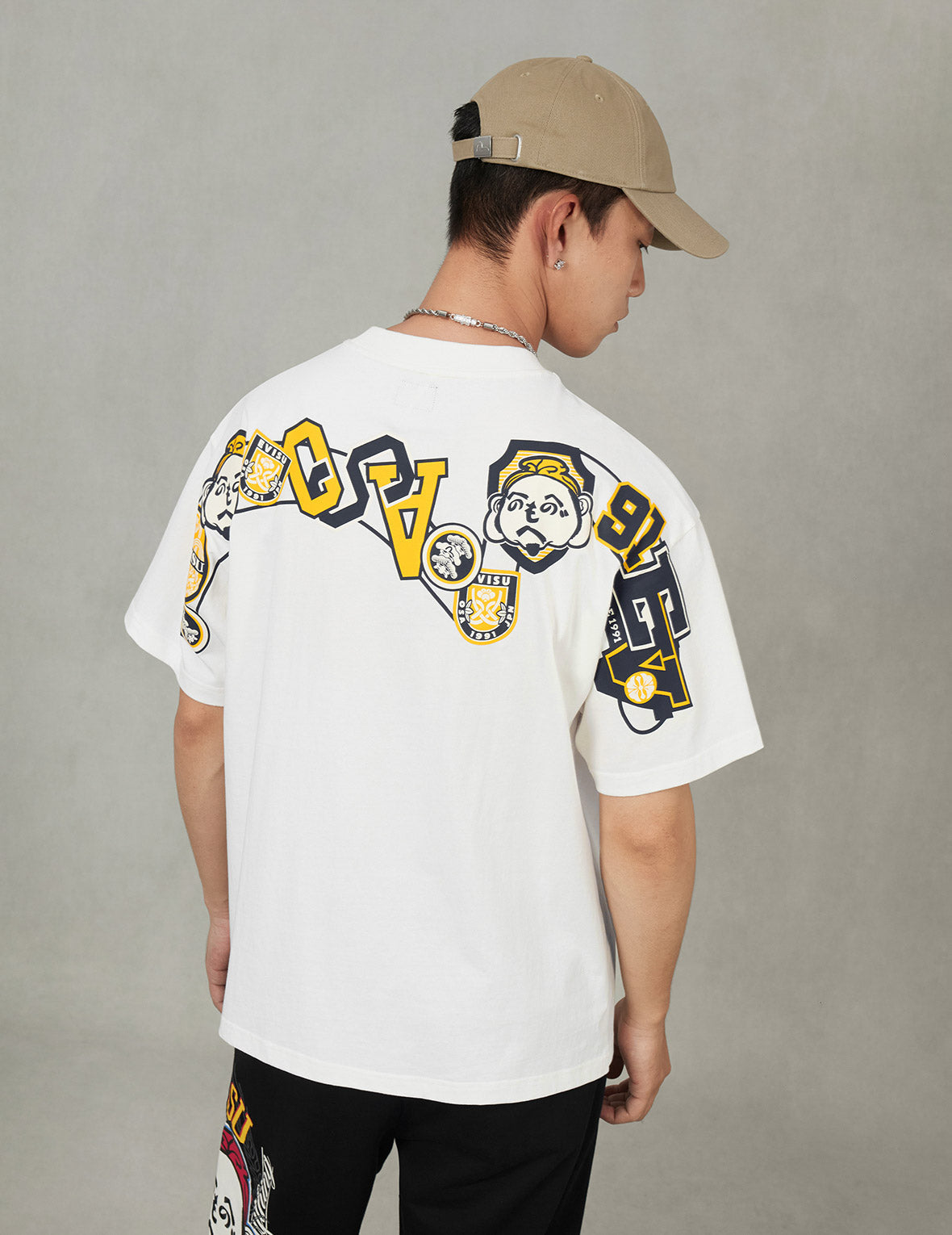 文字繪佛頭與智慧之輪標籤大M印花寬版休閒T恤